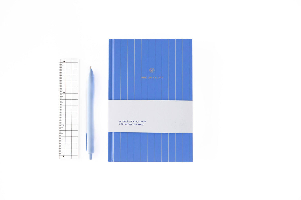Blue notebook with grid pattern on a white background