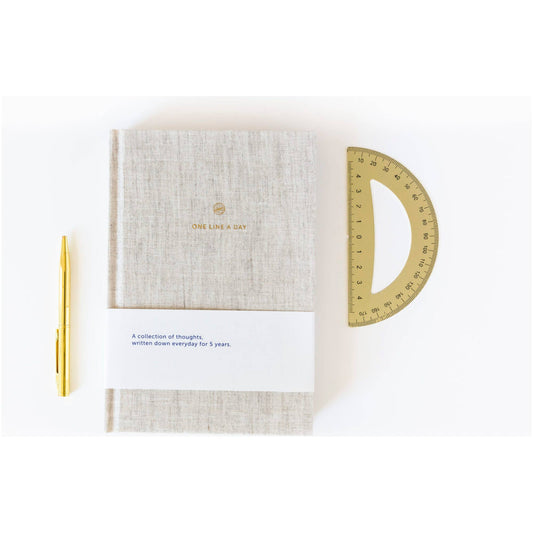Journal with textured cover and gold text on a white background