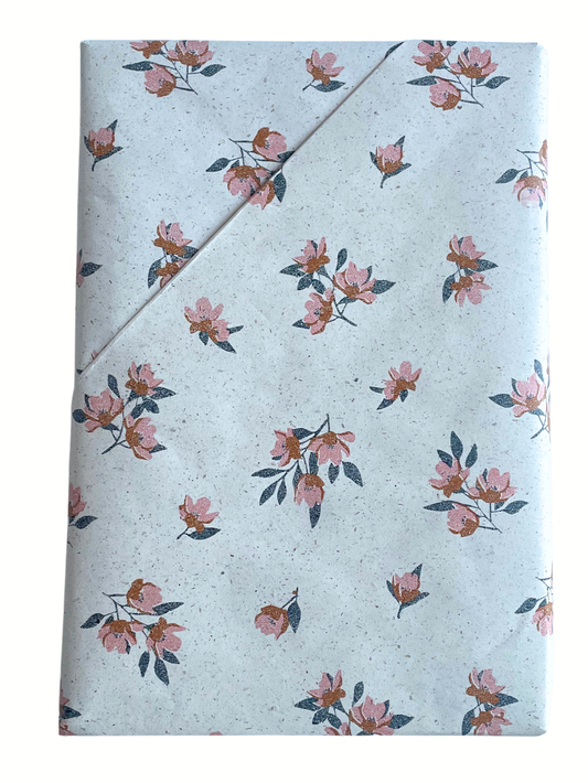 Journal with textured cover and gold text on a white background