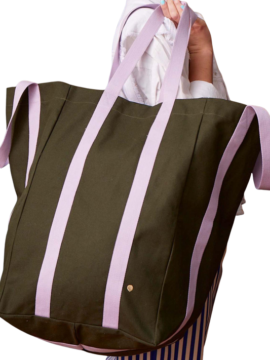 An olive green canvas tote bag with vertical lavender purple stripes and matching lavender shoulder straps, shown against a plain white background.