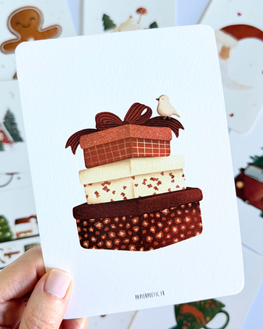 A square art print featuring a whimsical illustration of three stacked gift boxes with a small white bird perched on the top box. The print is displayed on a clean white background with a subtle drop shadow.