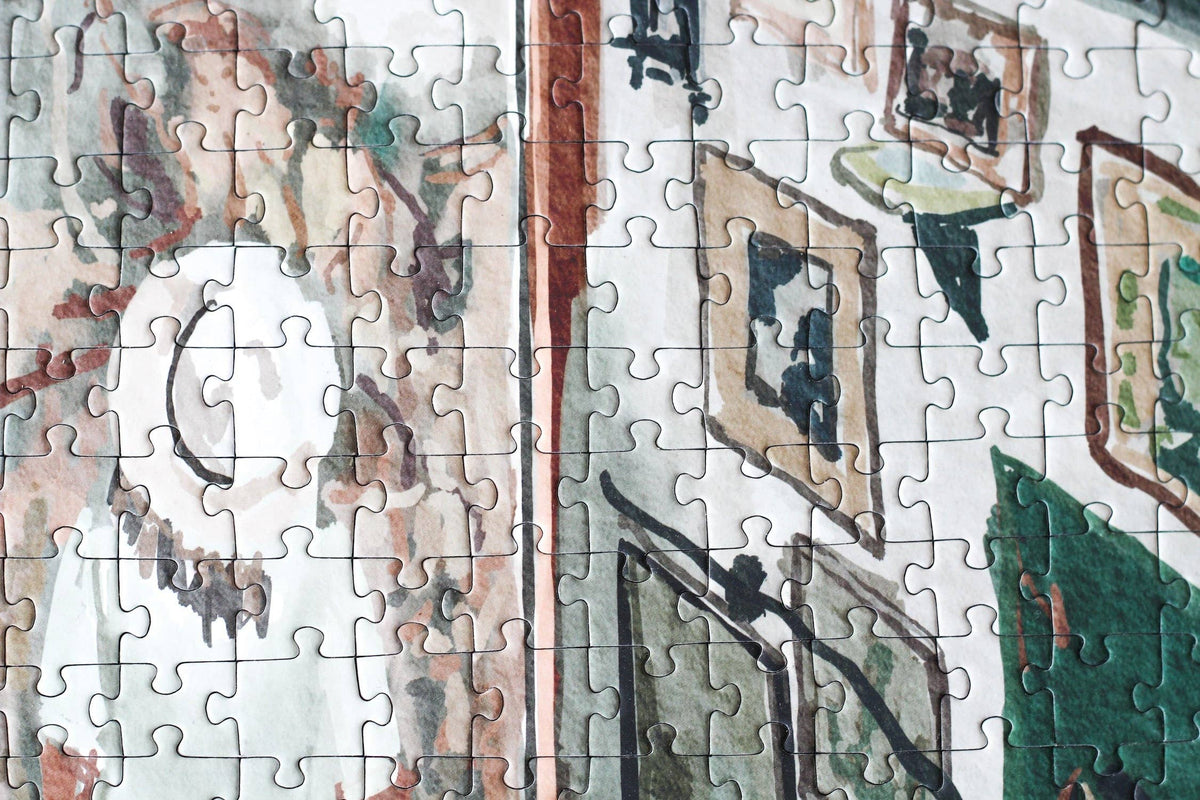 Partial puzzle with a scenic design, including trees and buildings.