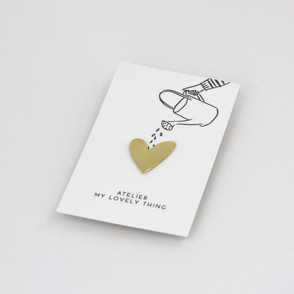 Gold heart-shaped pendant on a 'My Lovely Thing' card with a white background