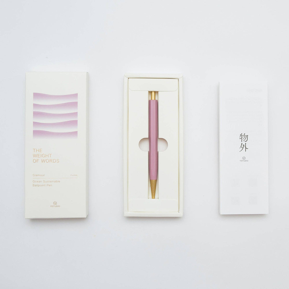 Pink pen with gold accent in a white box on a light gray background