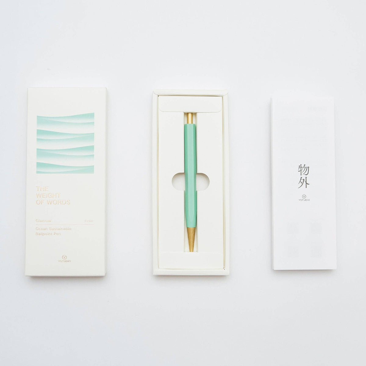 Mint green pen with gold accent in a white box on a light gray background