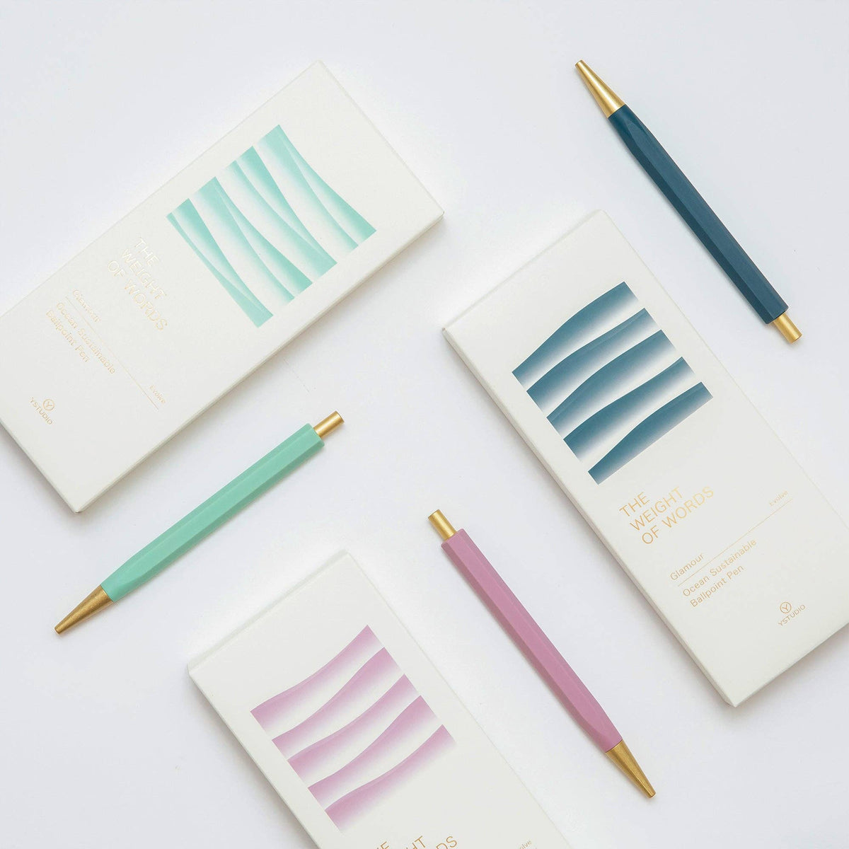 Notebooks with colorful pen tips on a white background