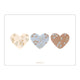 Three heart-shaped stickers with floral designs on a white background