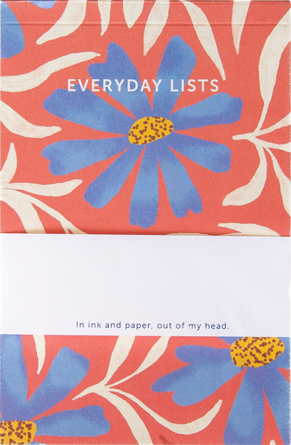 Notebook cover with blue flower design and text 'Everyday Lists' on a red background