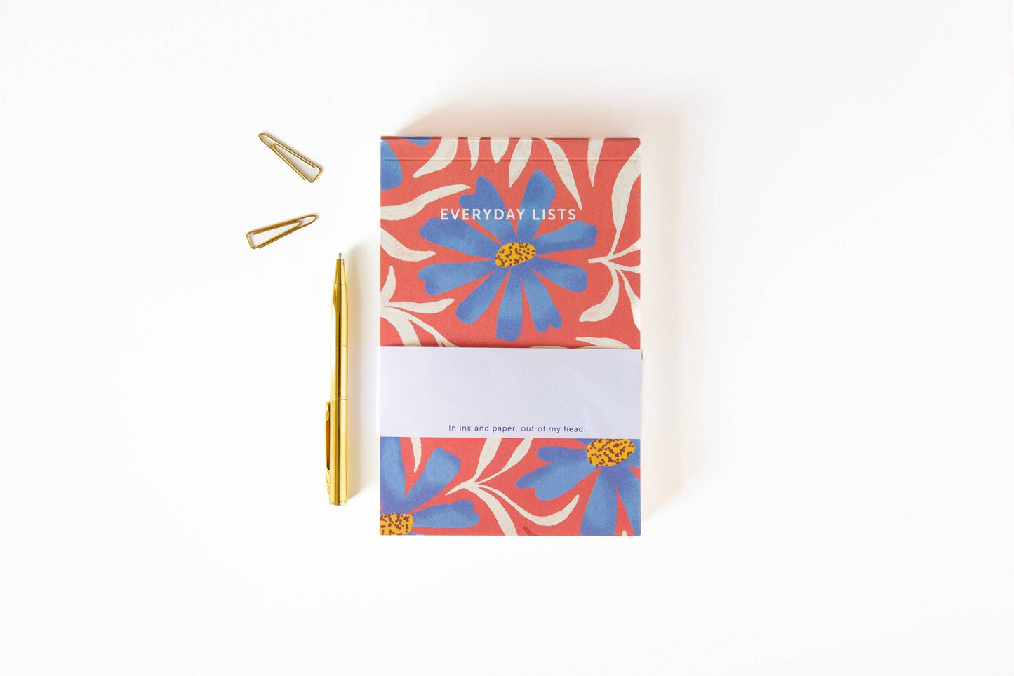 Floral notebook with a pen on a white background