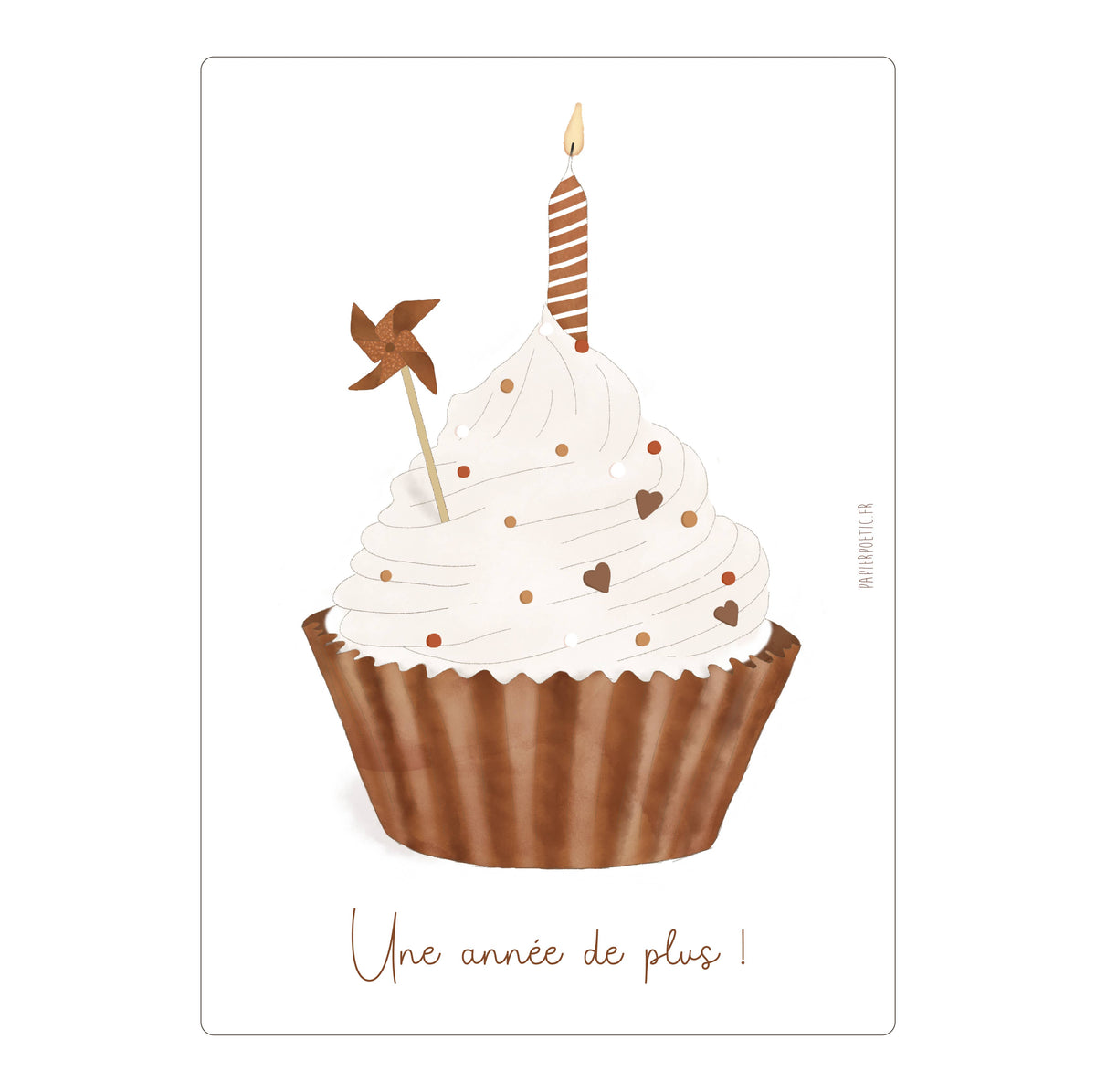A square greeting card or print featuring an illustrated cupcake with white frosting, brown wrapper, a candle, and a small pinwheel topper, with the French text 'Une année de plus !' at the bottom.