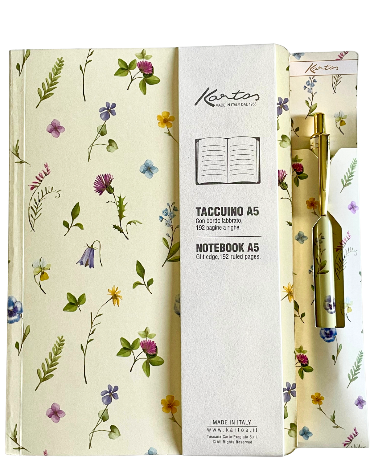 A Kanto A5 notebook set with a cream-colored floral-patterned cover, a white center label panel, and a gold pen tucked into a matching floral-patterned sleeve.