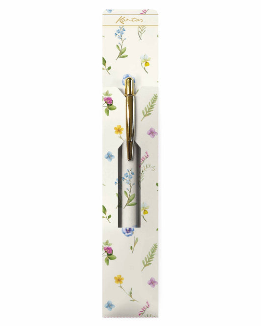 A Kantos Taccuino A5 notebook with a cream cover decorated with colorful wildflowers, shown with its white branded dust jacket and a matching floral gold pen on a white background.