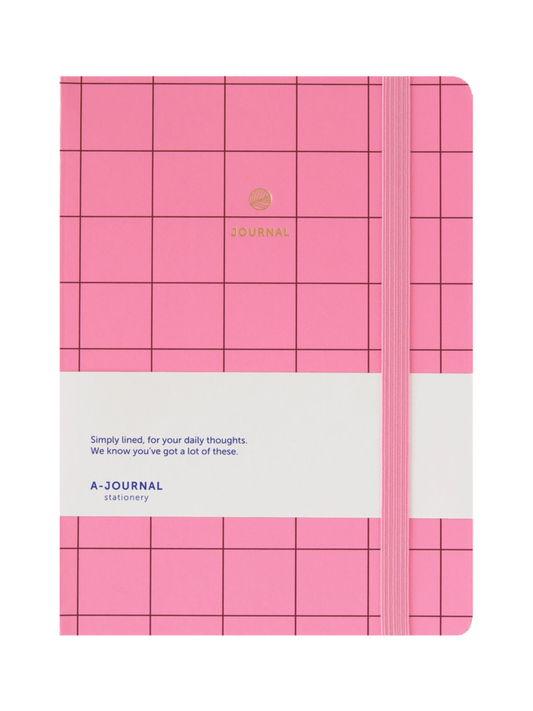 Pink grid-patterned hardcover journal with a white paper band around the middle and an elastic closure, photographed on a plain white background.