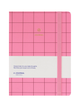 Pink grid-patterned hardcover journal with a white paper band around the middle and an elastic closure, photographed on a plain white background.