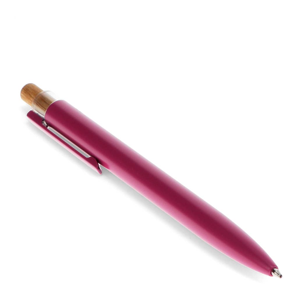 Pink pen with wooden cap on a white background