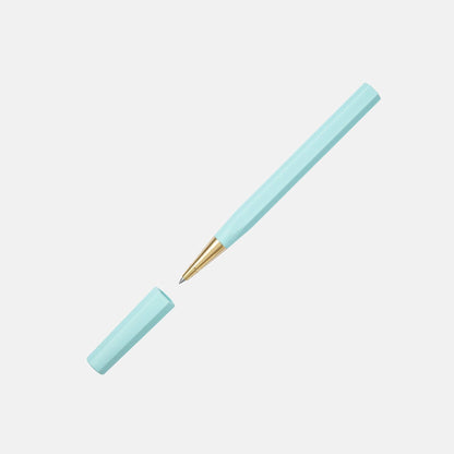 Light blue pen with gold clip on a light gray background
