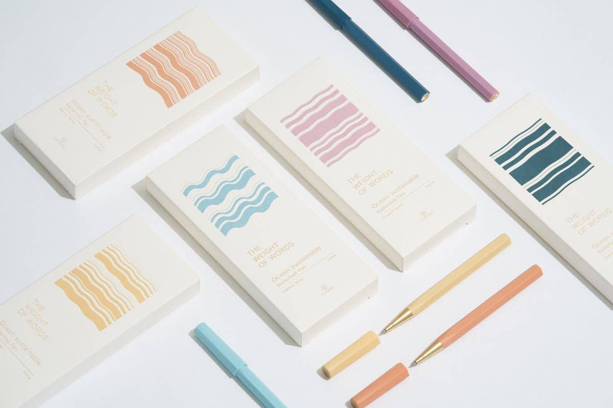 Notebooks with colorful abstract designs on a white background