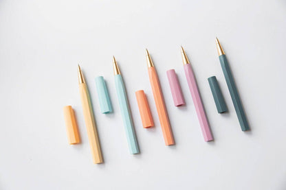 Set of colorful pens and markers on a white background