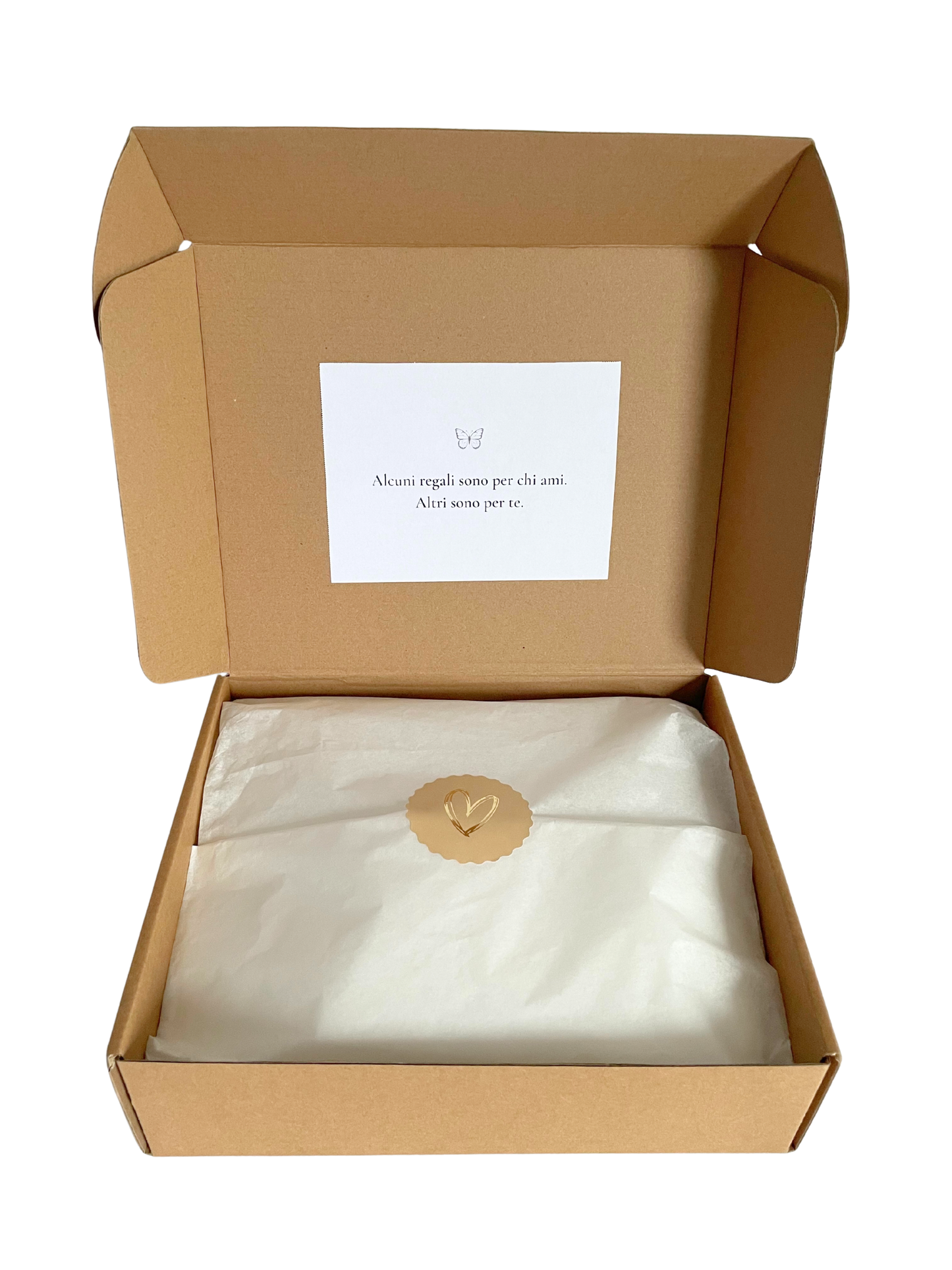 Open cardboard box with a white pillow and a small card inside on a white background