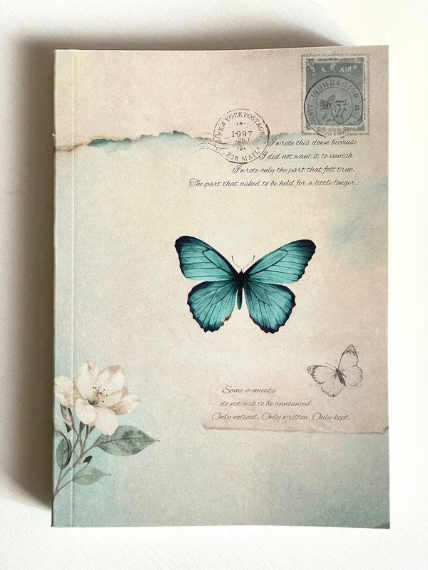 Notebook with a blue butterfly design on a beige background