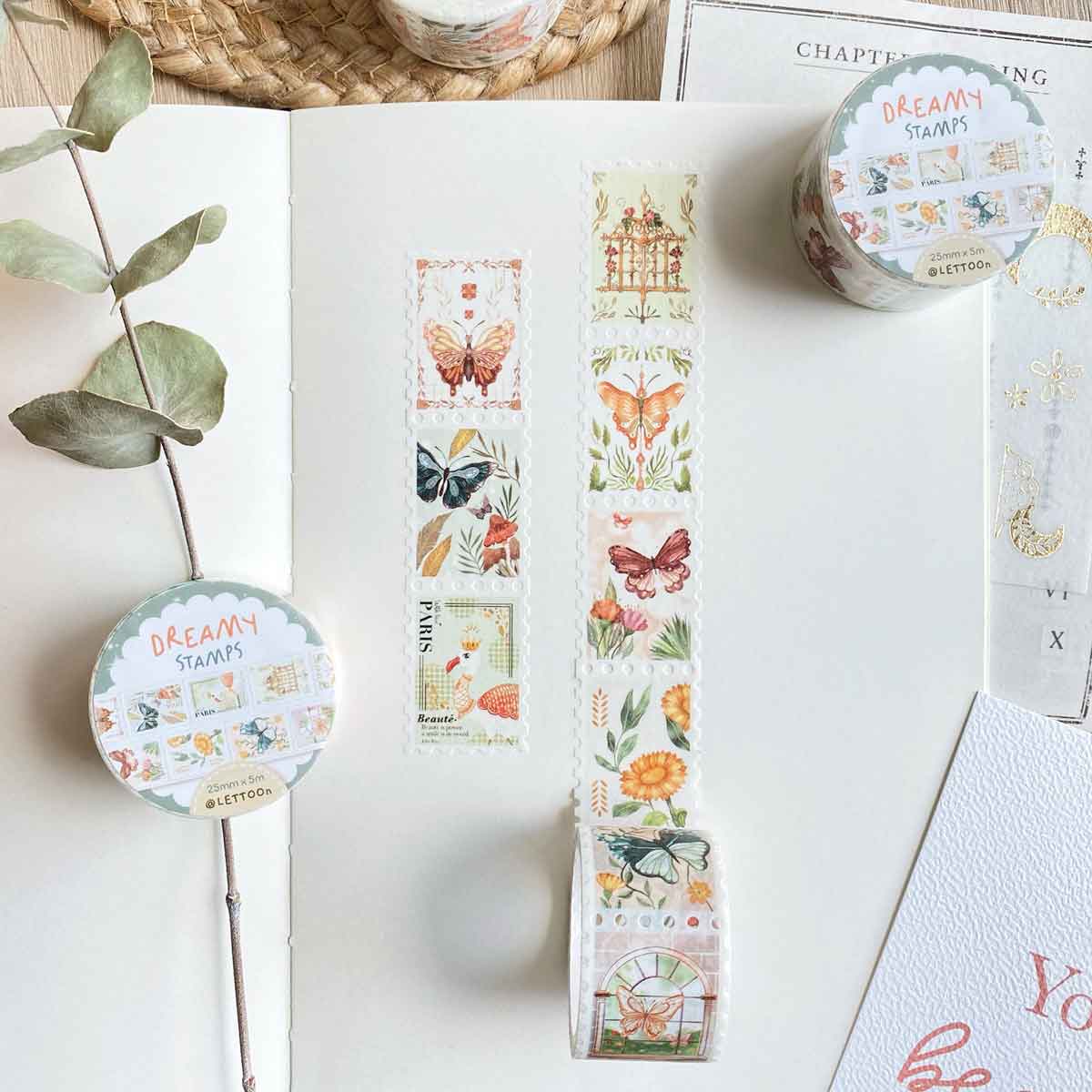 Decorative washi tape with butterfly and floral designs on a white surface.
