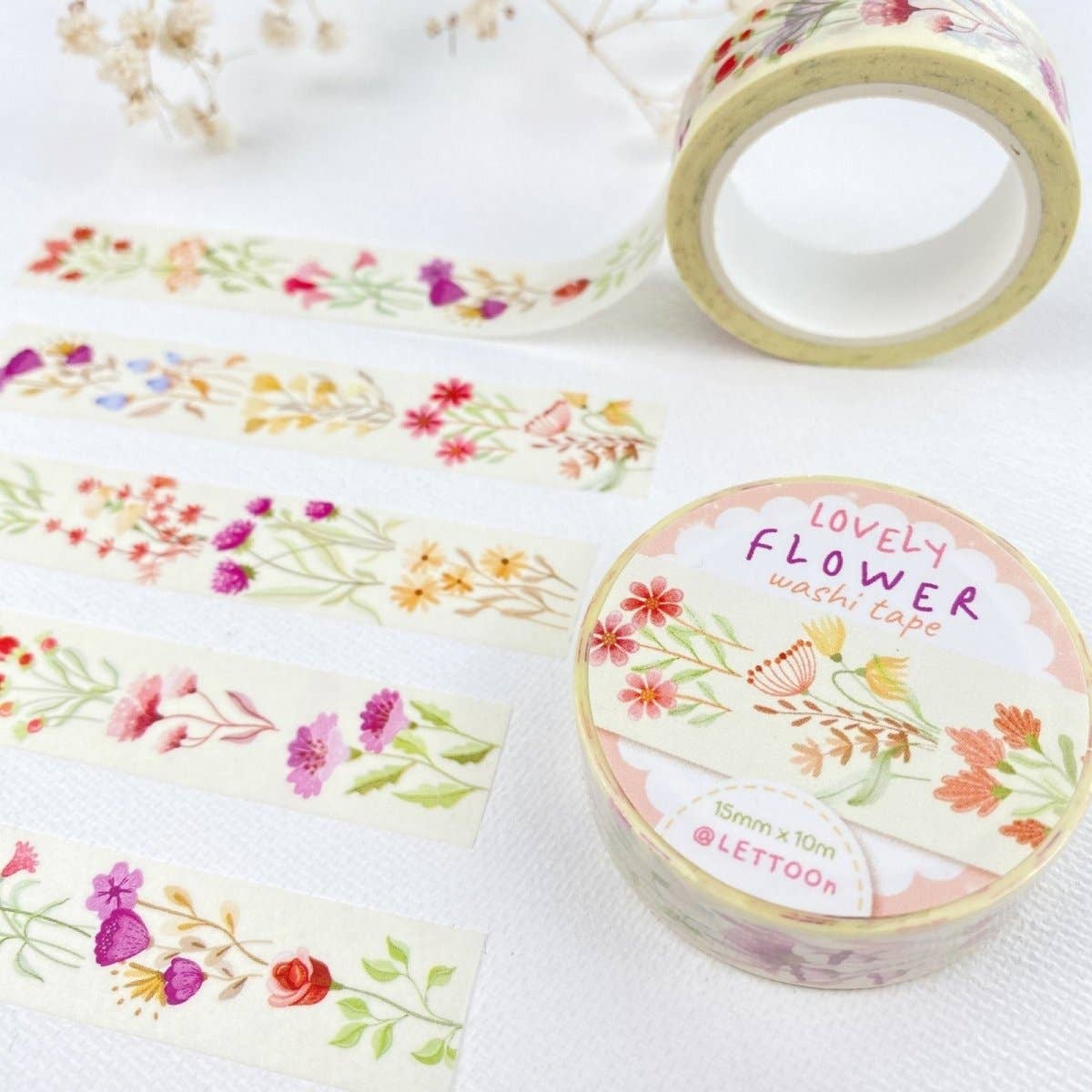 Floral washi tape with a visible brand label on a white background
