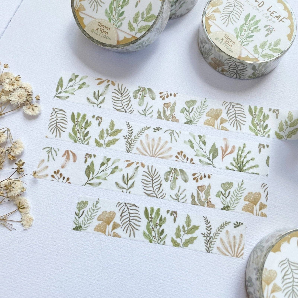 Washi tape with floral designs on a white surface