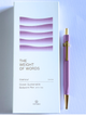 A lavender purple ballpoint pen with gold accents stands next to its white packaging box, which features the text 'THE WEIGHT OF WORDS' and 'Glamour Evolve Ocean Sustainable Ballpoint Pen (With Clip)' by YSTUDIO.