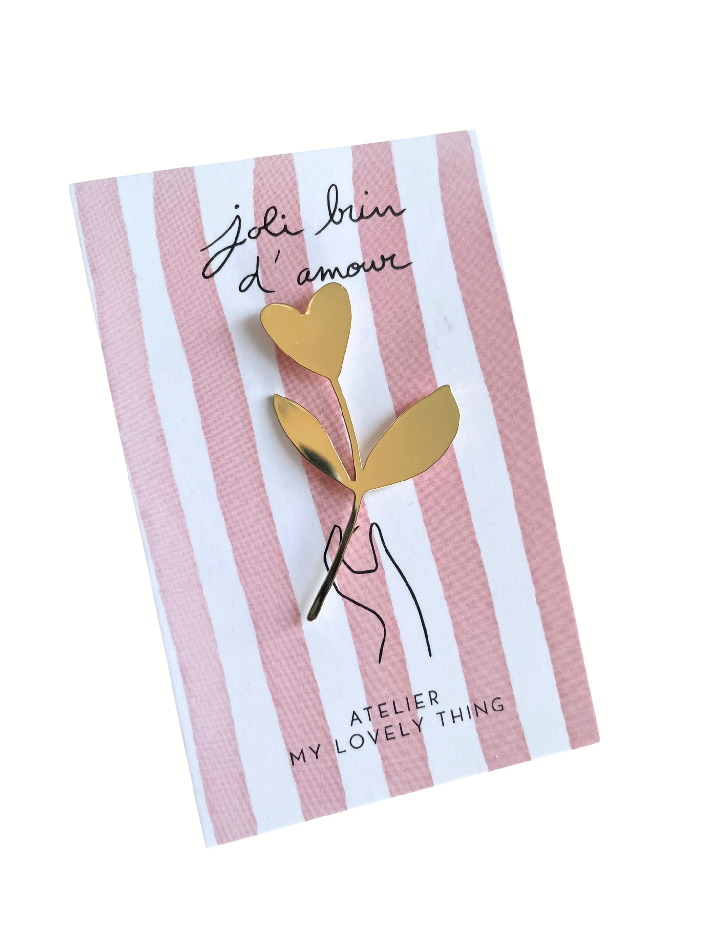 Gold heart-shaped brooch on a striped card with 'Atelier My Lovely Thing' branding
