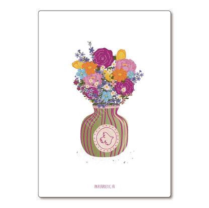 Colorful bouquet of flowers in a striped vase on a white background