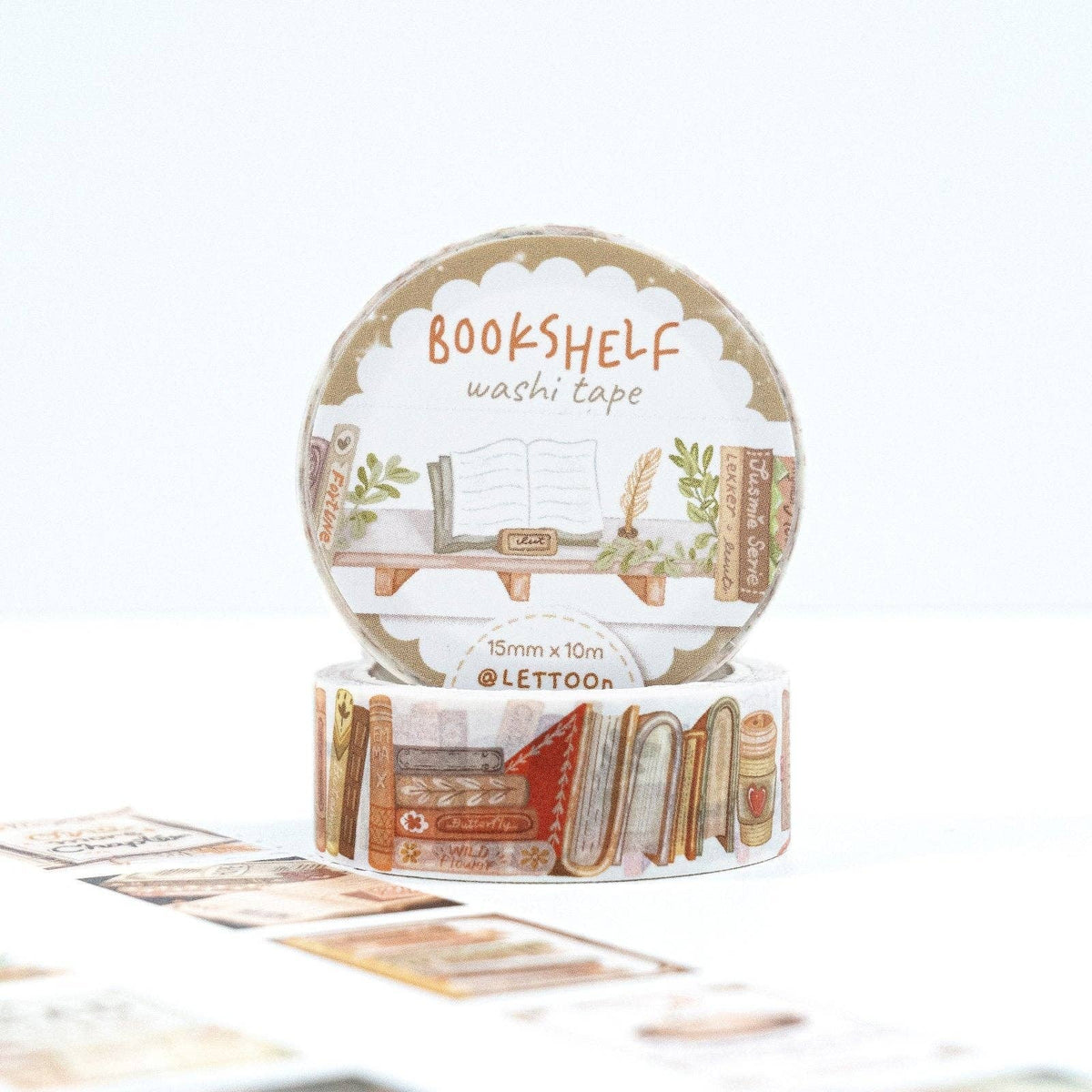 A roll of LETTOON Bookshelf washi tape standing upright, with another roll partially visible underneath. The tape features an illustrated bookshelf with books, plants, and decorative elements in warm neutral tones.