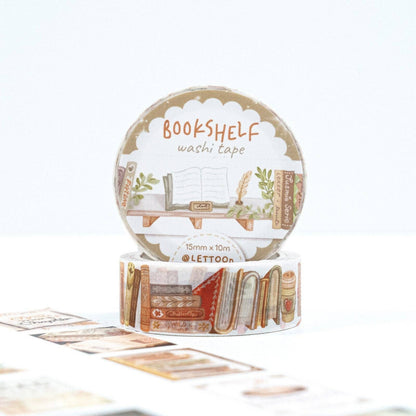 A roll of LETTOON Bookshelf washi tape standing upright, with another roll partially visible underneath. The tape features an illustrated bookshelf with books, plants, and decorative elements in warm neutral tones.