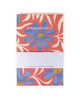 A card deck or notebook titled 'EVERYDAY LISTS' with a coral-red, blue, and cream floral pattern, wrapped with a white paper band that reads 'In ink and paper, out of my head.' on a white background.