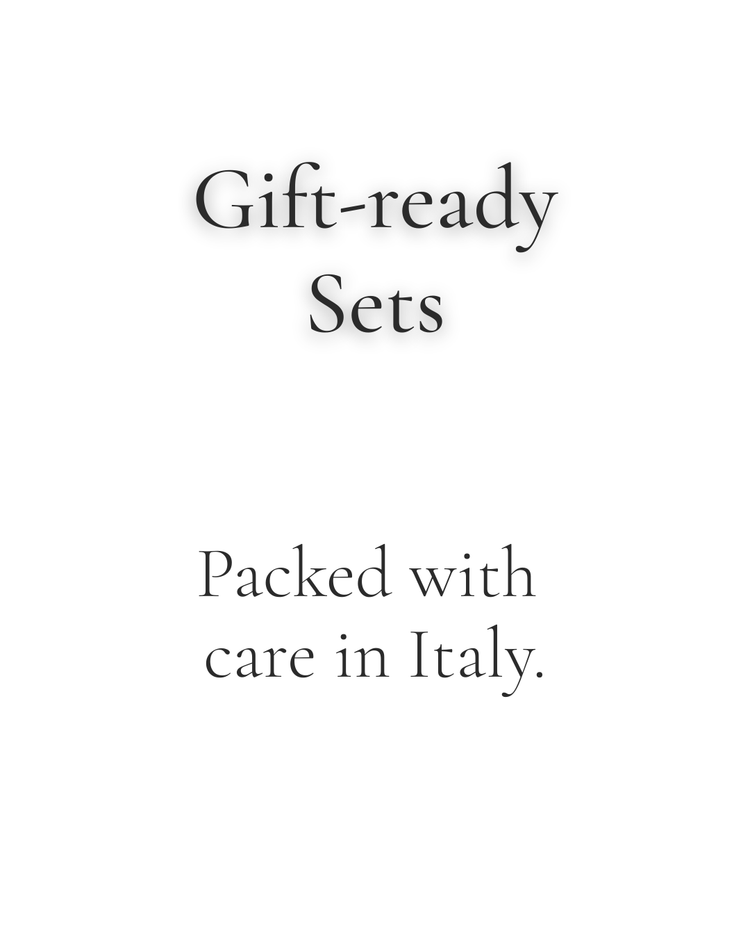 Text 'Gift-ready Sets Packed with care in Italy' on a white background