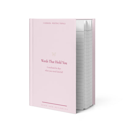 Pink notebook titled 'Words That Hold You' on a white background