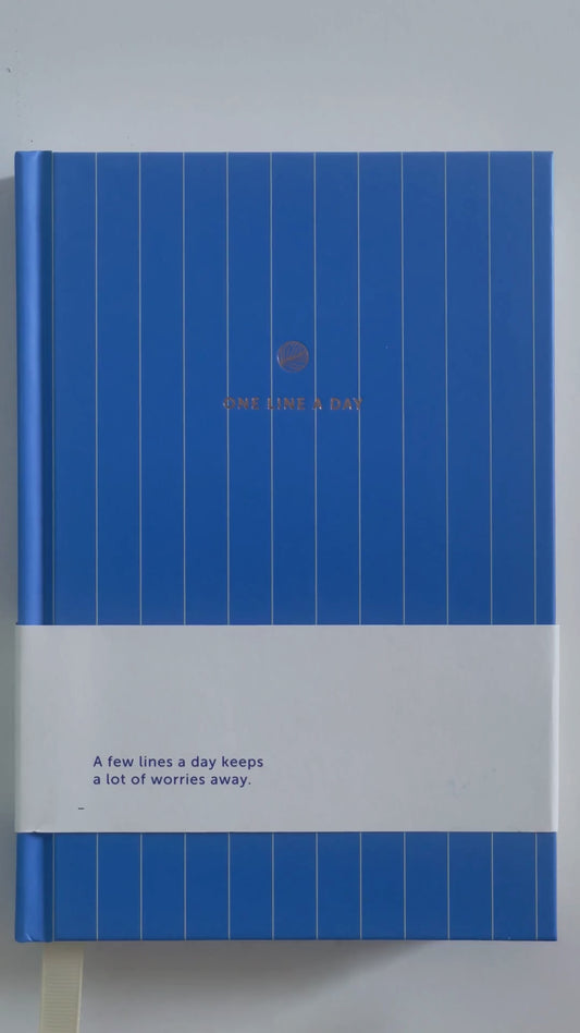 Blue notebook with white text on a white background