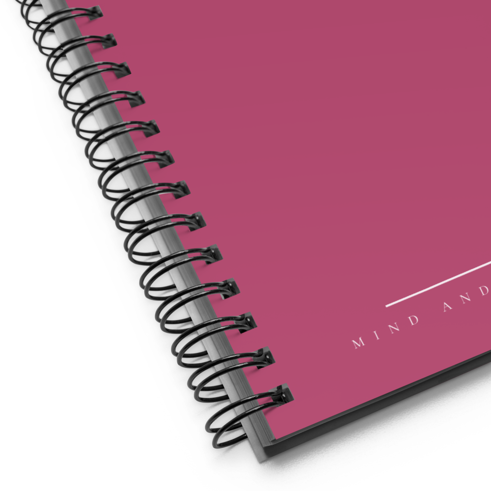 Spiral-bound notebook with a pink cover and 'MIND AND' branding.