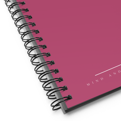 Spiral-bound notebook with a pink cover and 'MIND AND' branding.