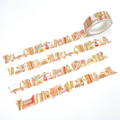 A roll of decorative washi tape with a vintage bookish illustration pattern, shown partially unrolled on a clean white background.